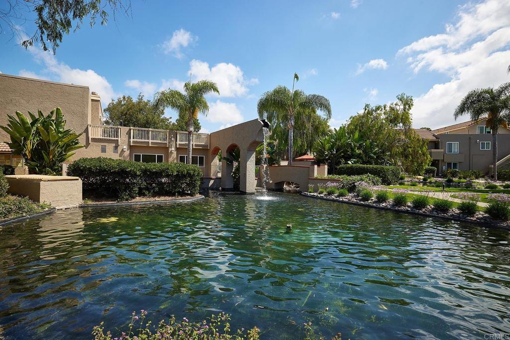 930 Via Mil Cumbres, Unit 52 Solana Beach, CA 92075 - Photo 3 of 34 a view of a house with a swimming pool