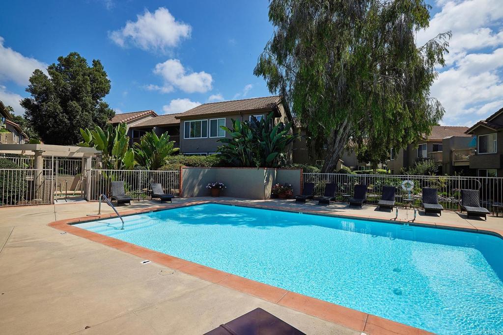 930 Via Mil Cumbres, Unit 52 Solana Beach, CA 92075 - Photo 33 of 34 a view of a swimming pool with a patio