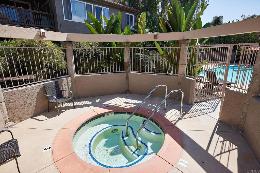 930 Via Mil Cumbres, Unit 52 Solana Beach, CA 92075 - Photo 34 of 34 a terrace with outdoor seating and trees