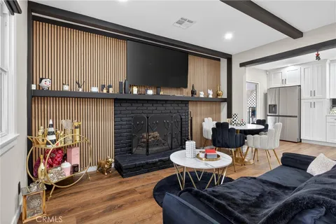 a living room with furniture a rug and a fireplace