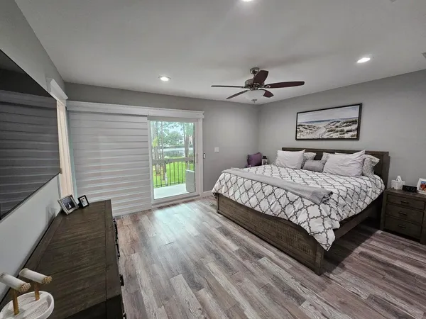 a bedroom with a bed and a table in it