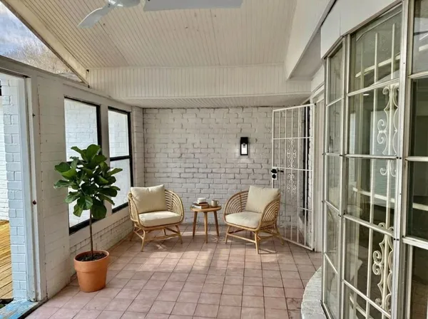 a view of house with yard and green space