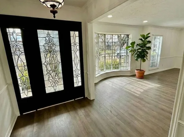 a view of entryway with wooden floor