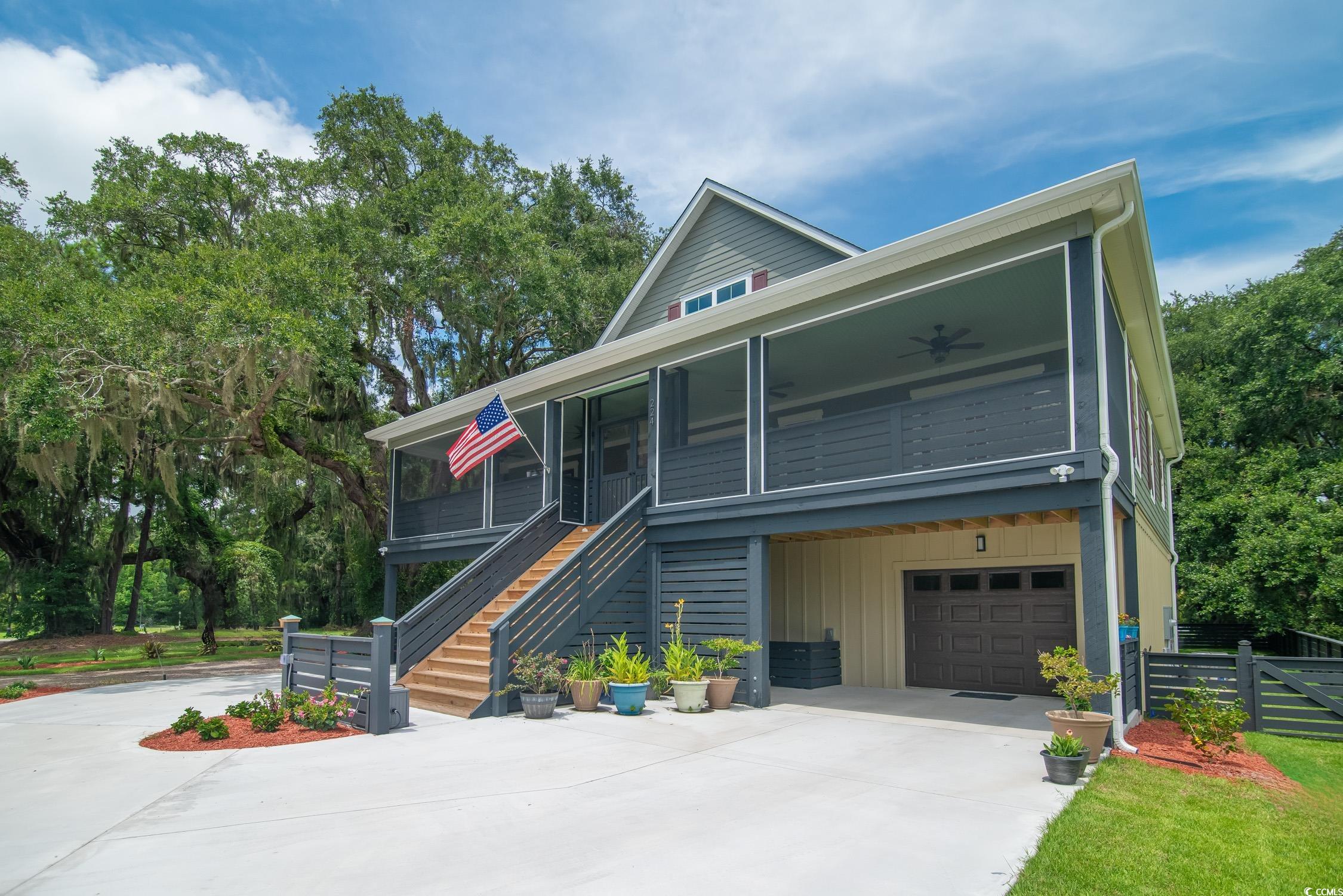 Tbd South Bay Street Georgetown, SC 29440 - Photo 2 of 28 View of front facade with a ceiling fan, stairs, d