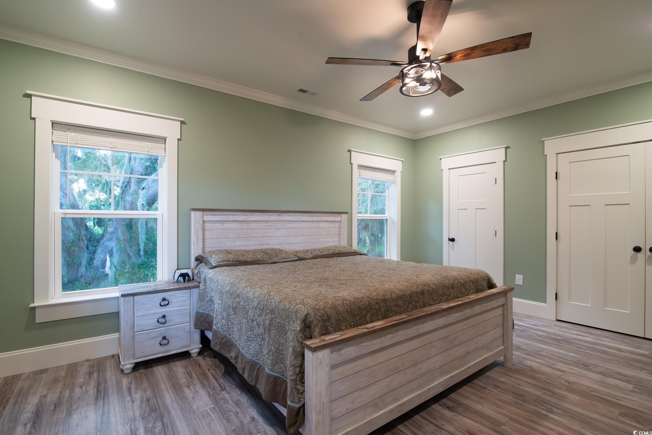 Tbd South Bay Street Georgetown, SC 29440 - Photo 6 of 28 Bedroom with ornamental molding, two closets, dark