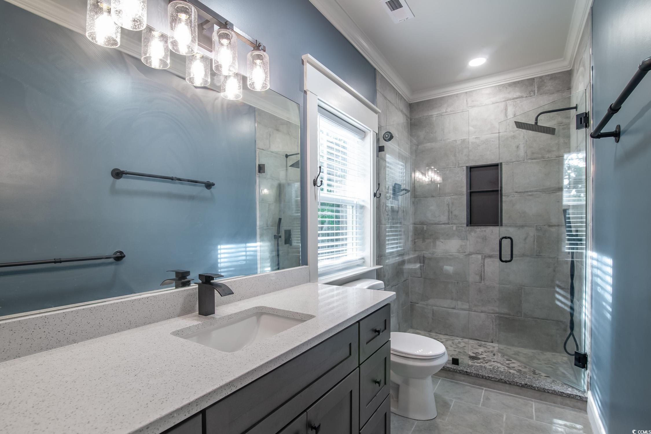 Tbd South Bay Street Georgetown, SC 29440 - Photo 8 of 28 Bathroom featuring vanity, a stall shower, crown m