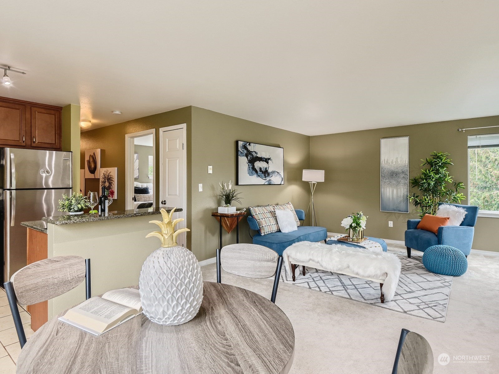 20328 Bothell Everett Highway, Unit B304 Bothell, WA 98012 - Photo 13 of 27 a living room with furniture and a table