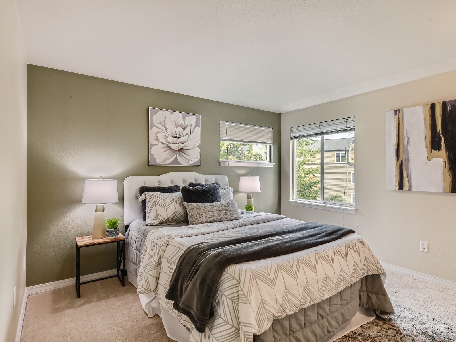20328 Bothell Everett Highway, Unit B304 Bothell, WA 98012 - Photo 15 of 27 a bedroom with a bed and a painting on the wall