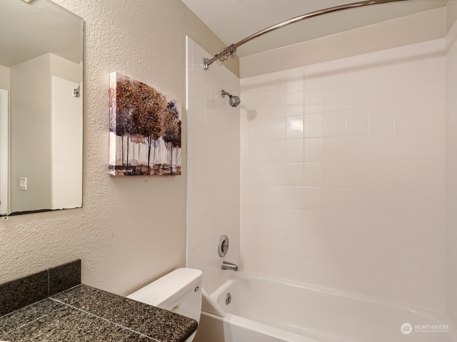 20328 Bothell Everett Highway, Unit B304 Bothell, WA 98012 - Photo 20 of 27 a bathroom with a bathtub and shower