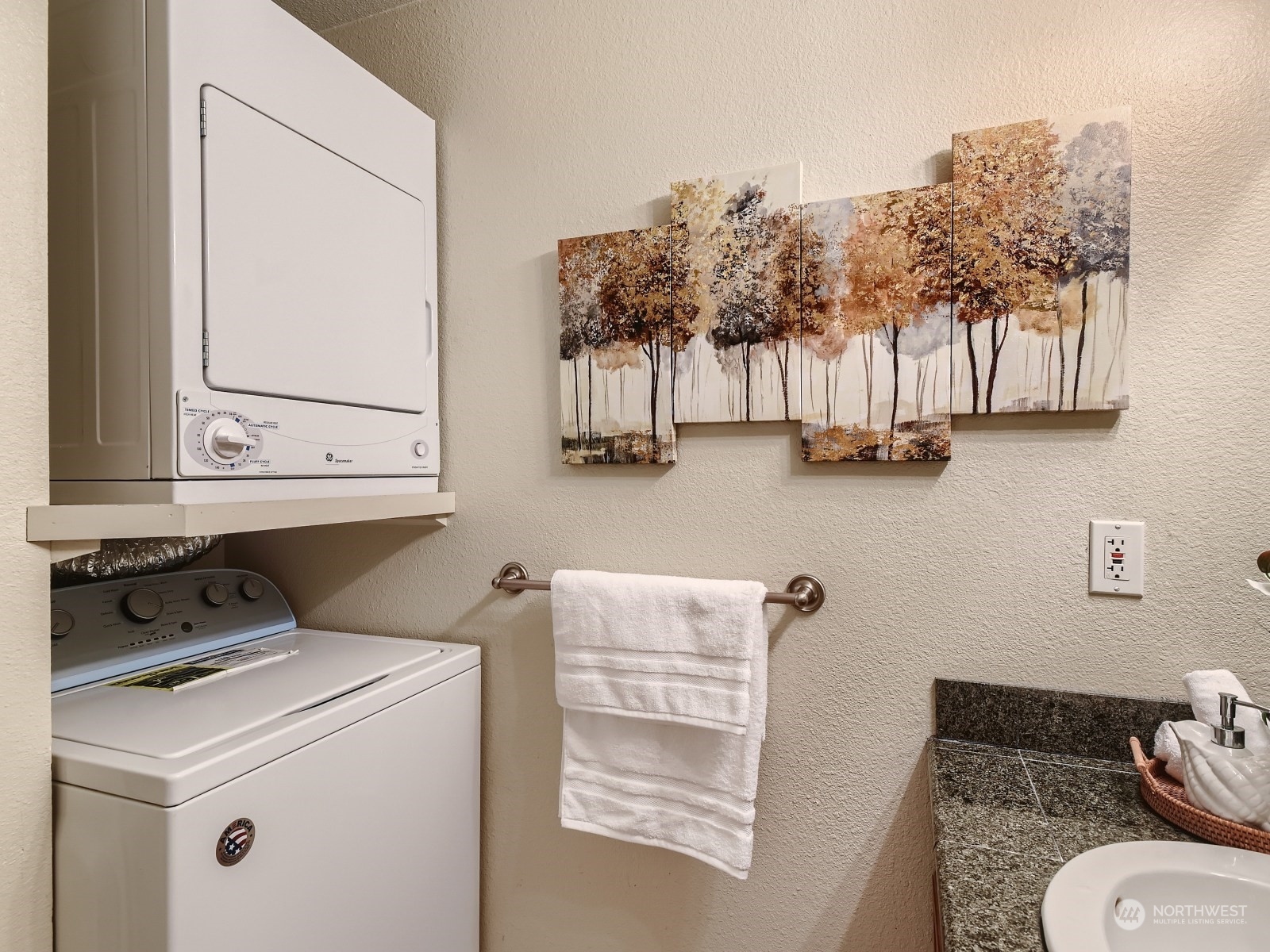 20328 Bothell Everett Highway, Unit B304 Bothell, WA 98012 - Photo 21 of 27 a bathroom with a toilet a sink and a mirror