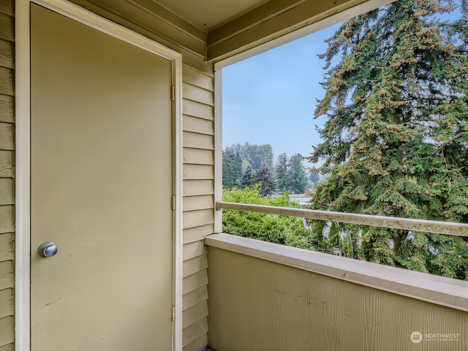 20328 Bothell Everett Highway, Unit B304 Bothell, WA 98012 - Photo 22 of 27 a view of a glass door and a balcony