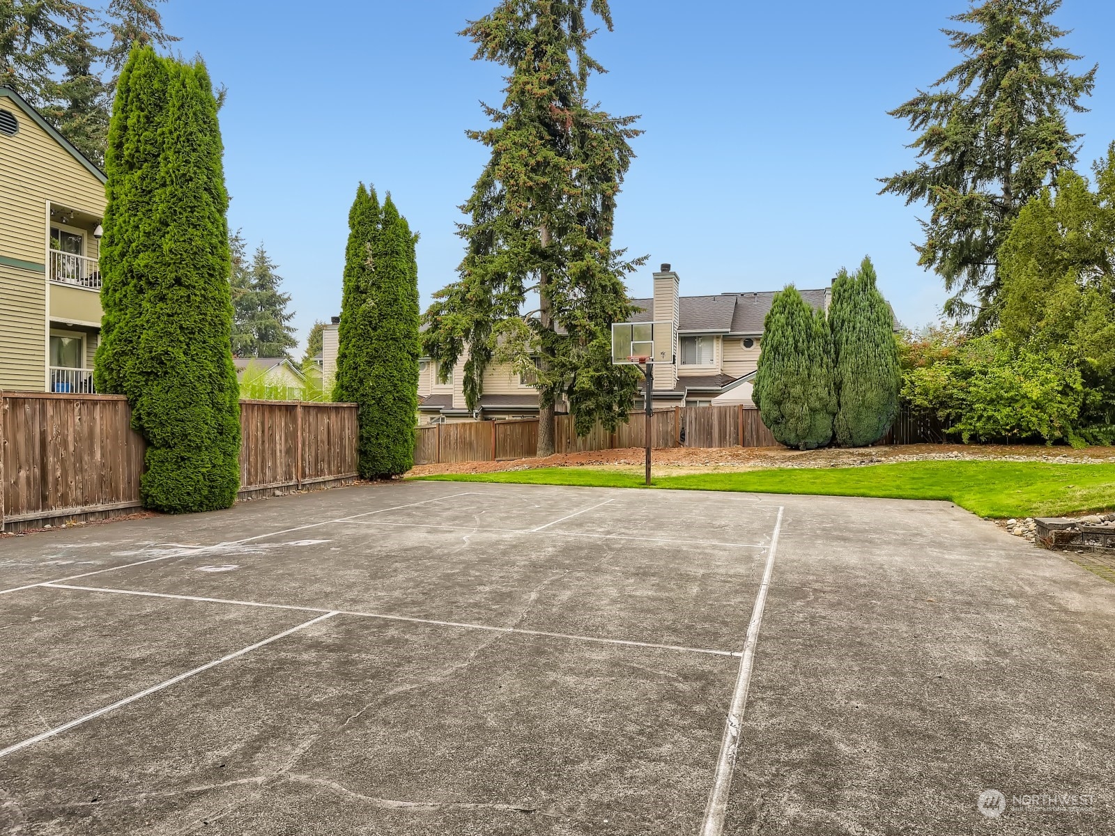 20328 Bothell Everett Highway, Unit B304 Bothell, WA 98012 - Photo 25 of 27 a view of a swimming pool with a yard and palm trees