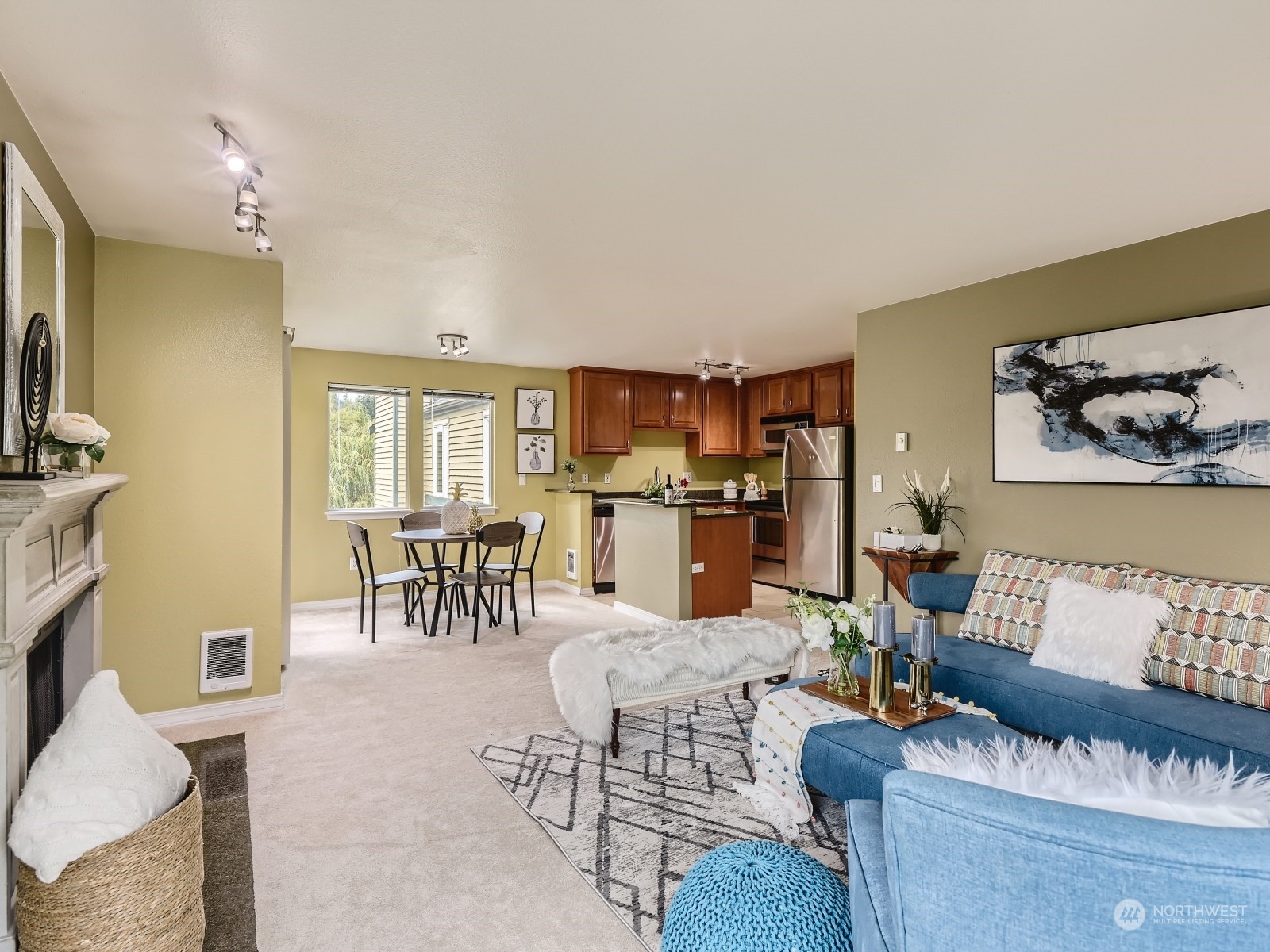 20328 Bothell Everett Highway, Unit B304 Bothell, WA 98012 - Photo 6 of 27 a living room with furniture and kitchen view
