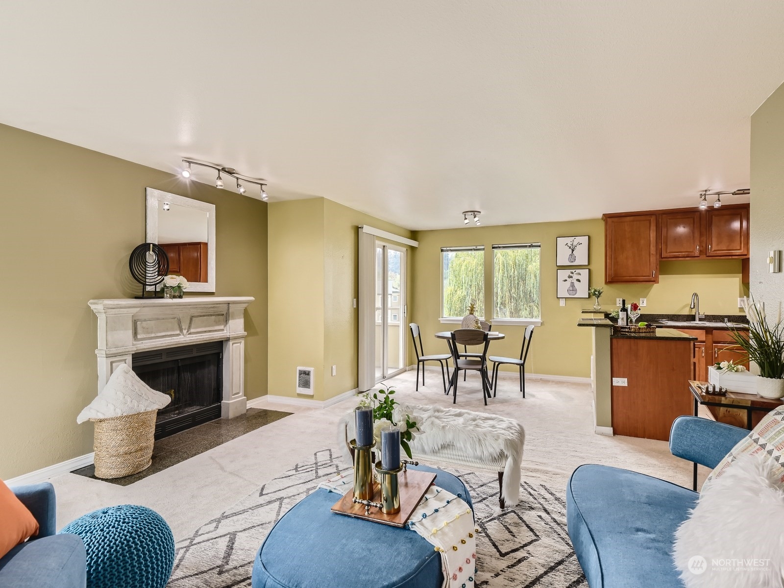 20328 Bothell Everett Highway, Unit B304 Bothell, WA 98012 - Photo 7 of 27 a living room with furniture and a fireplace