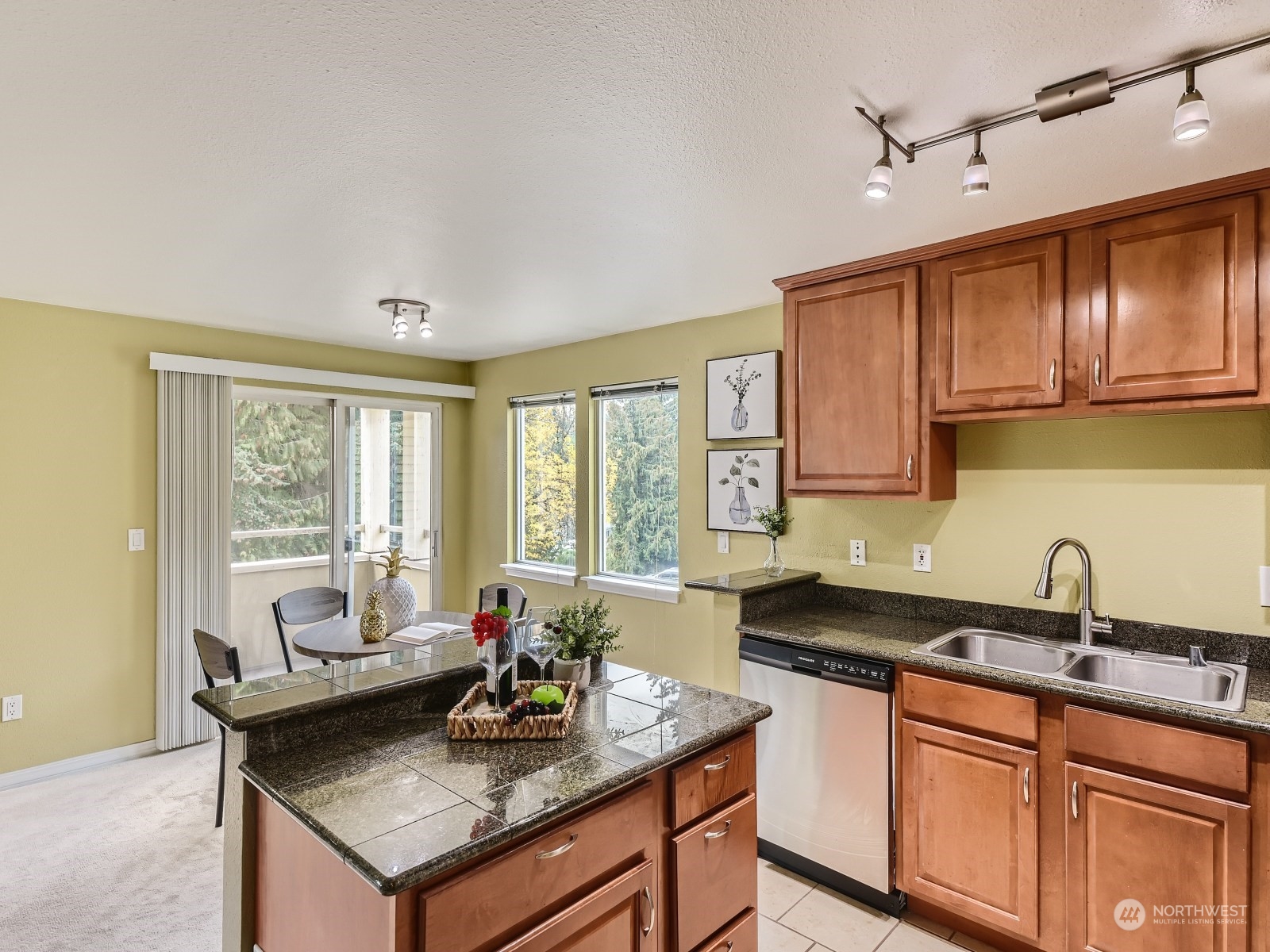 20328 Bothell Everett Highway, Unit B304 Bothell, WA 98012 - Photo 10 of 27 a kitchen with a stove a sink and cabinets