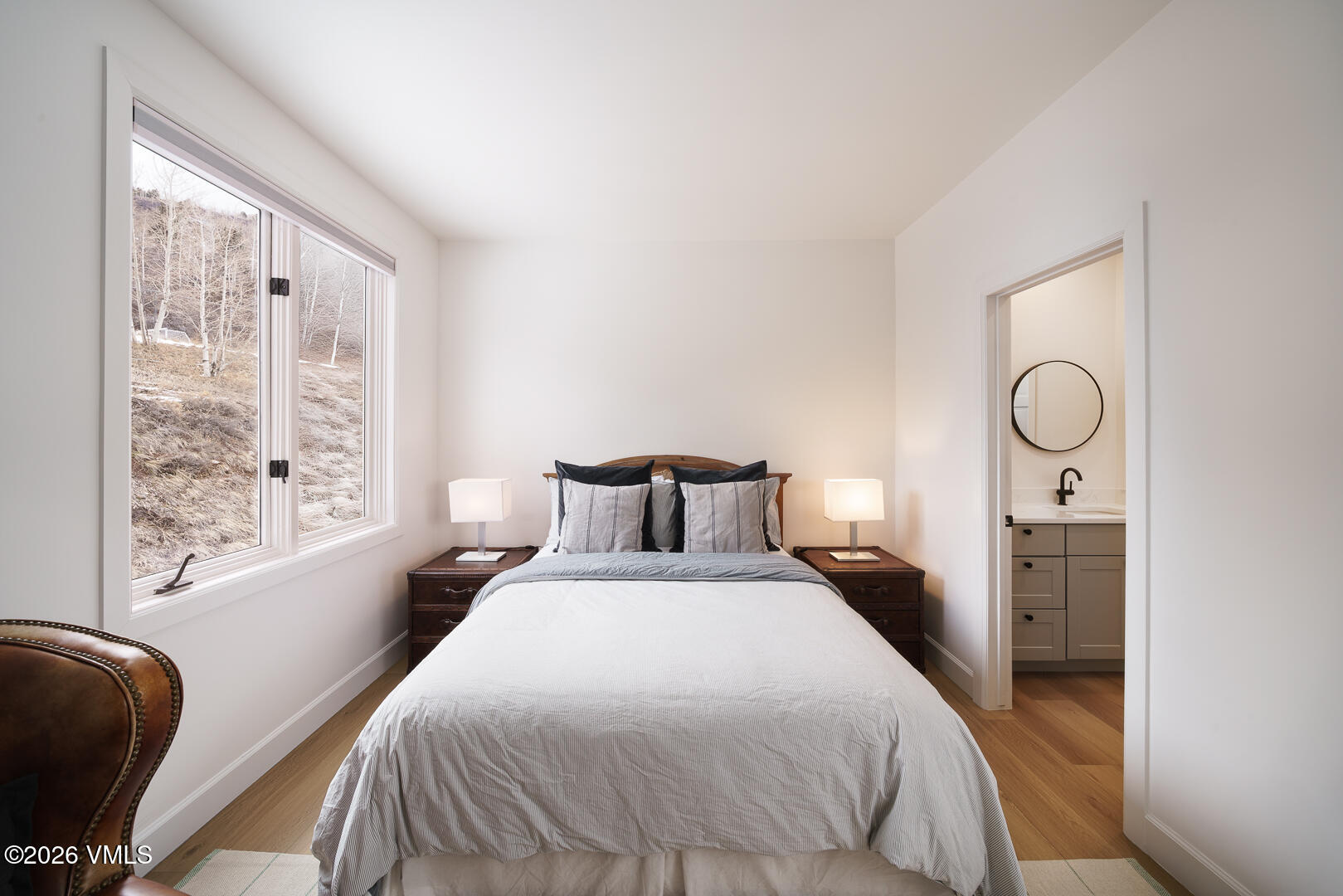 625 North Frontage Road West, Unit 32B Vail, CO 81657 - Photo 17 of 34 a large bed sitting in a bedroom next to a window