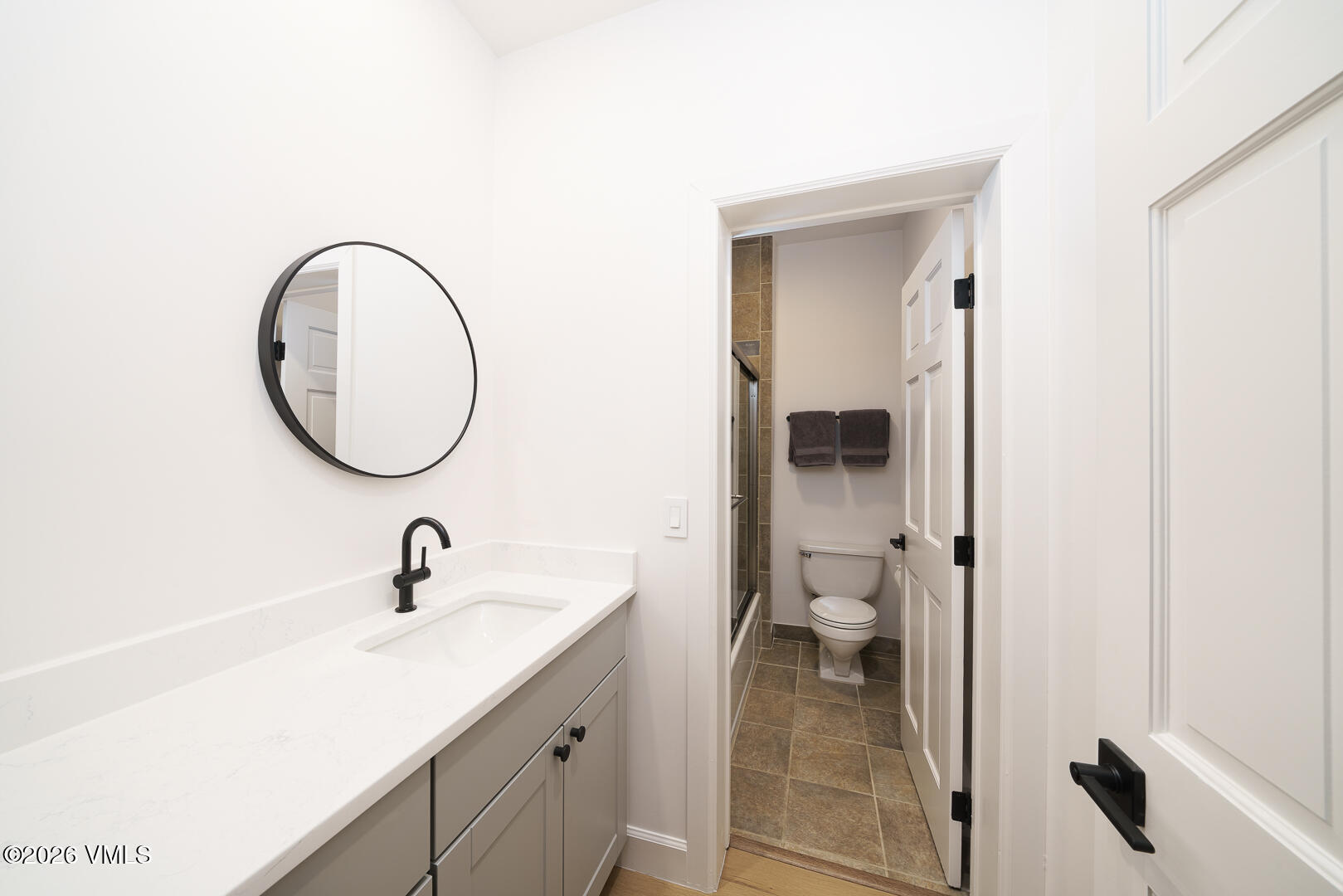 625 North Frontage Road West, Unit 32B Vail, CO 81657 - Photo 18 of 34 a bathroom with a toilet a sink and a mirror