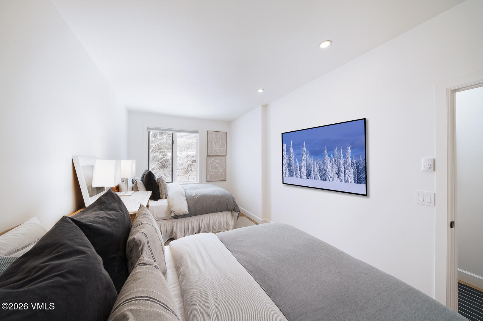 625 North Frontage Road West, Unit 32B Vail, CO 81657 - Photo 20 of 34 a living room with couches painting on the wall and a window