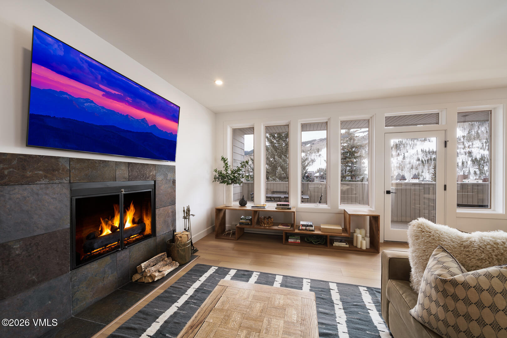 625 North Frontage Road West, Unit 32B Vail, CO 81657 - Photo 3 of 34 a living room with furniture and a fireplace