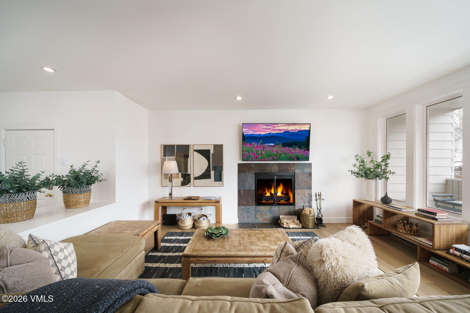 625 North Frontage Road West, Unit 32B Vail, CO 81657 - Photo 5 of 34 a living room with furniture and a fireplace