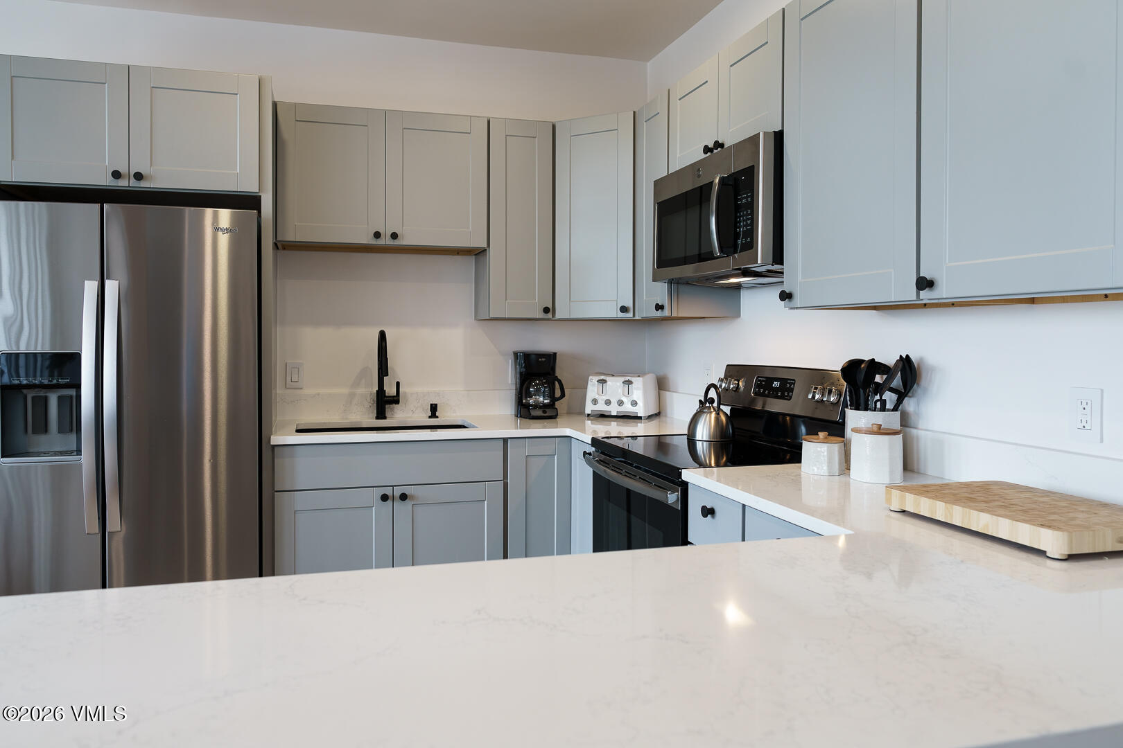 625 North Frontage Road West, Unit 32B Vail, CO 81657 - Photo 9 of 34 a kitchen with stainless steel appliances a refrigerator sink and microwave