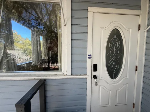 a bathroom with a sink a mirror and window