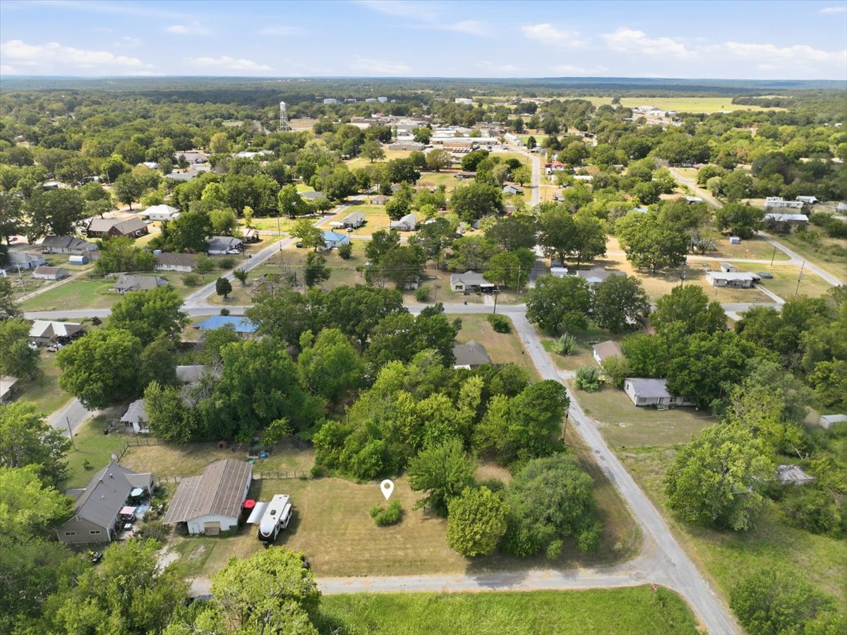Expansive lot with mature trees and direct street access