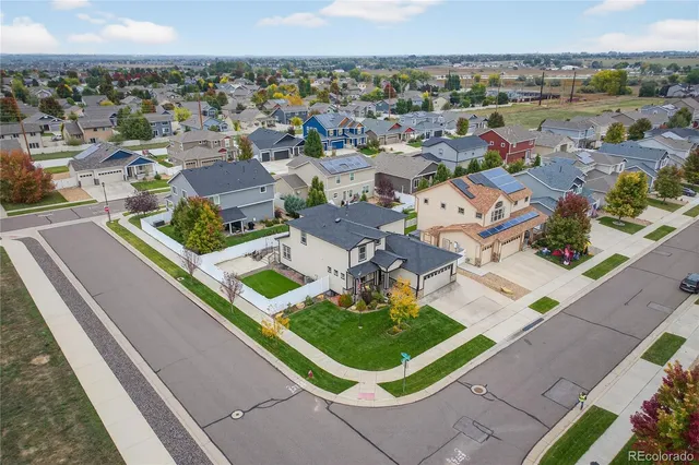 an aerial view of a house with a swimming pool