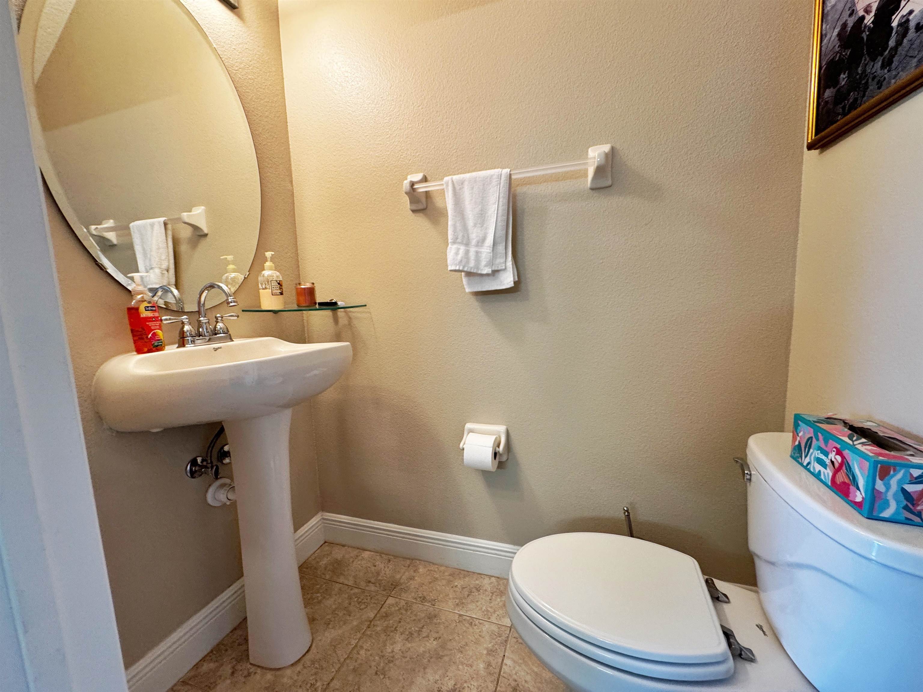 80 Riverview Bend South, Unit 814 Palm Coast, FL 32137 - Photo 16 of 39 a bathroom with a sink mirror toilet and bathroom