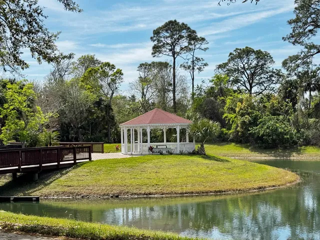 a view of a lake with a house in the background
