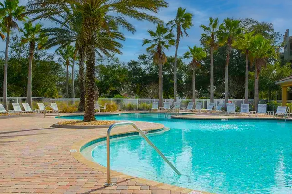 a view of a swimming pool with a patio