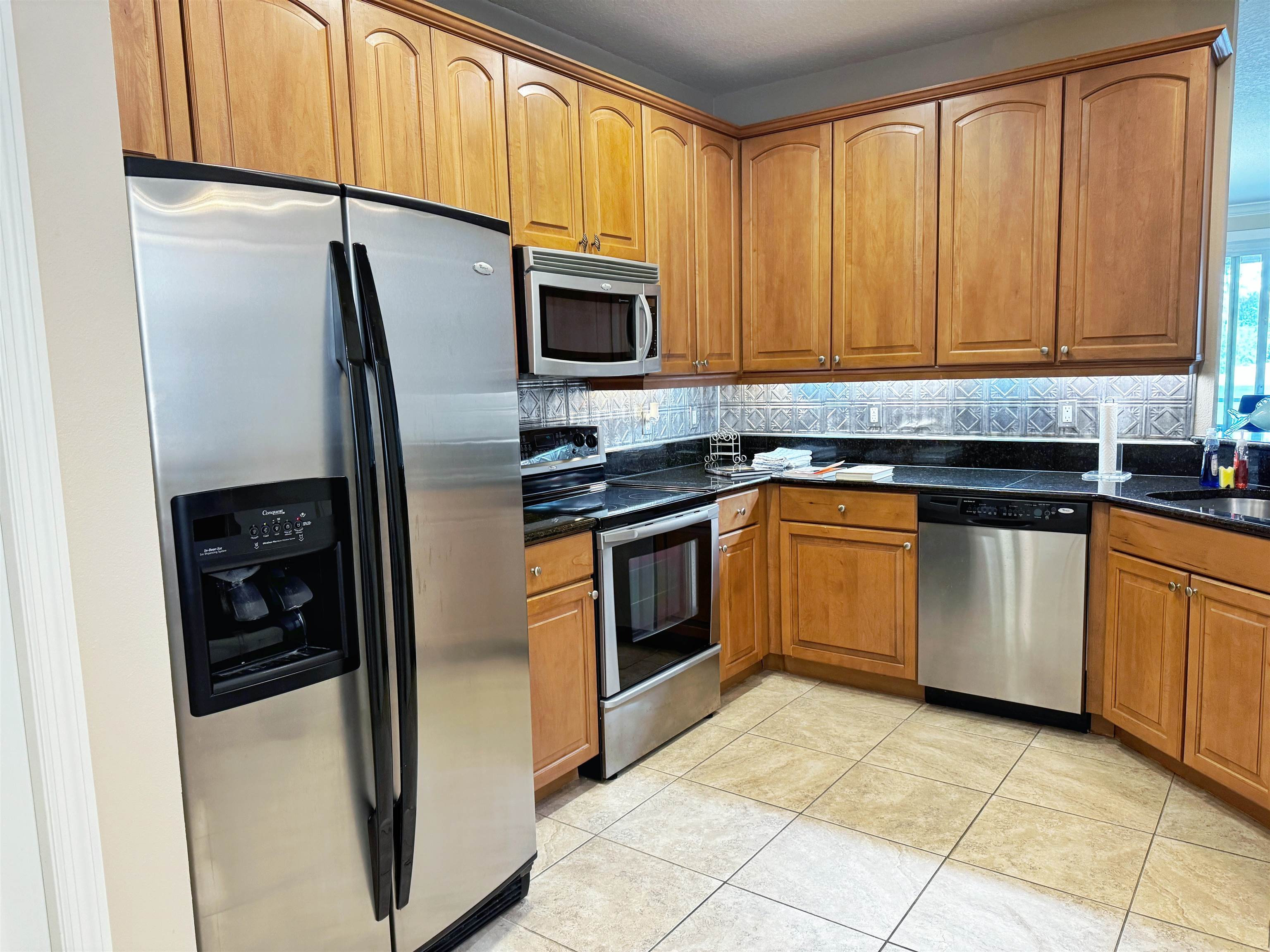 80 Riverview Bend South, Unit 814 Palm Coast, FL 32137 - Photo 6 of 39 a kitchen with a sink stove and refrigerator