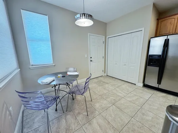 a view of a room with breakfast area and chandelier