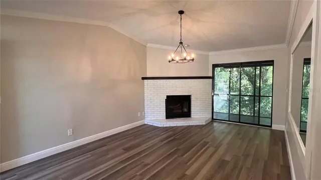 a view of kitchen with granite countertop cabinets and wooden floor