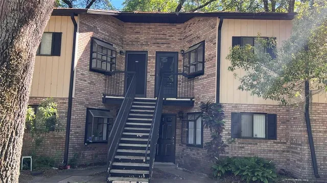a kitchen with stainless steel appliances a refrigerator sink and cabinets
