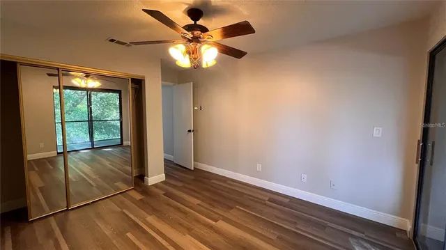 a bathroom with a toilet a sink and a mirror
