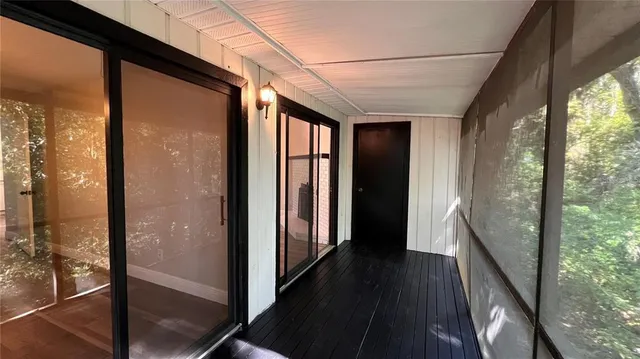 a view of a balcony with wooden floor