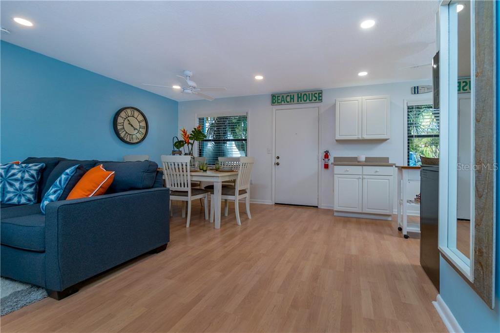 5041 North Beach Road, Unit 3B Englewood, FL 34223 - Photo 15 of 55 a living room with furniture and a wooden floor