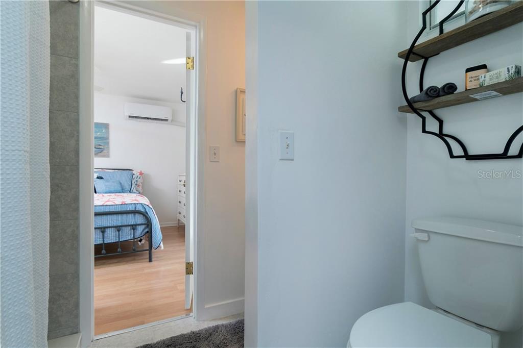 5041 North Beach Road, Unit 3B Englewood, FL 34223 - Photo 21 of 55 a bathroom view with a sink and mirror