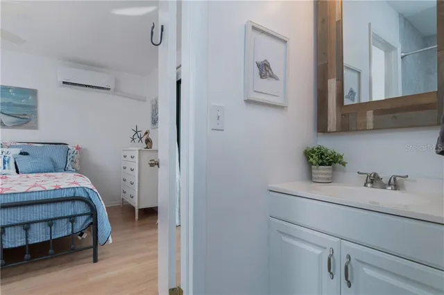 a bedroom with a bed and a table in it