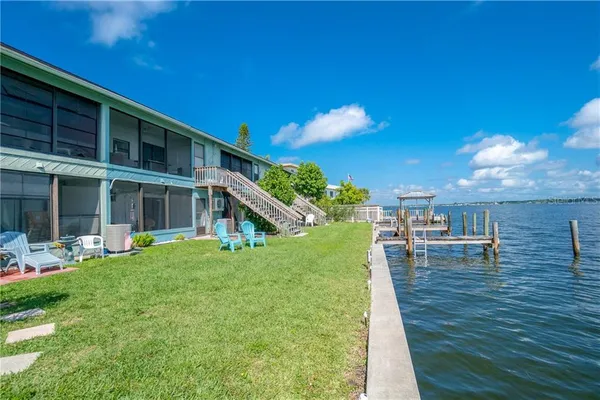 a view of a swimming pool with a yard