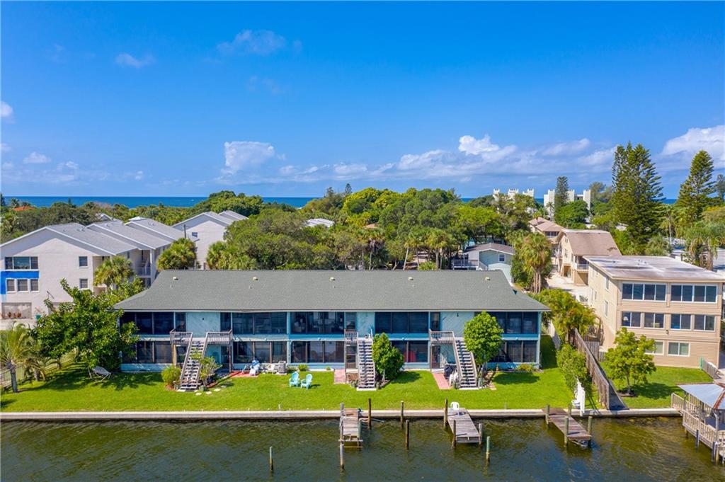 5041 North Beach Road, Unit 3B Englewood, FL 34223 - Photo 42 of 55 an aerial view of a house with swimming pool garden and patio