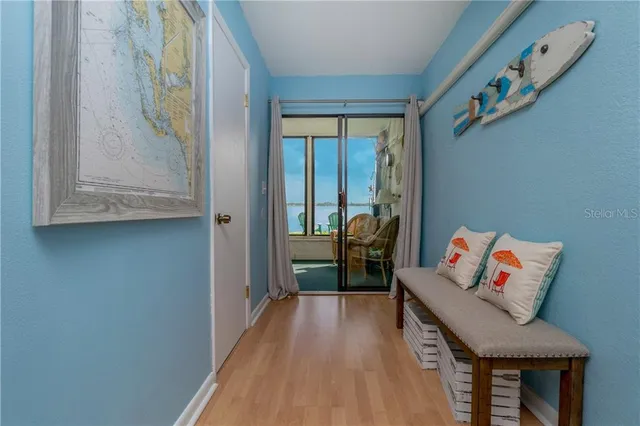 a hallway with table and couch