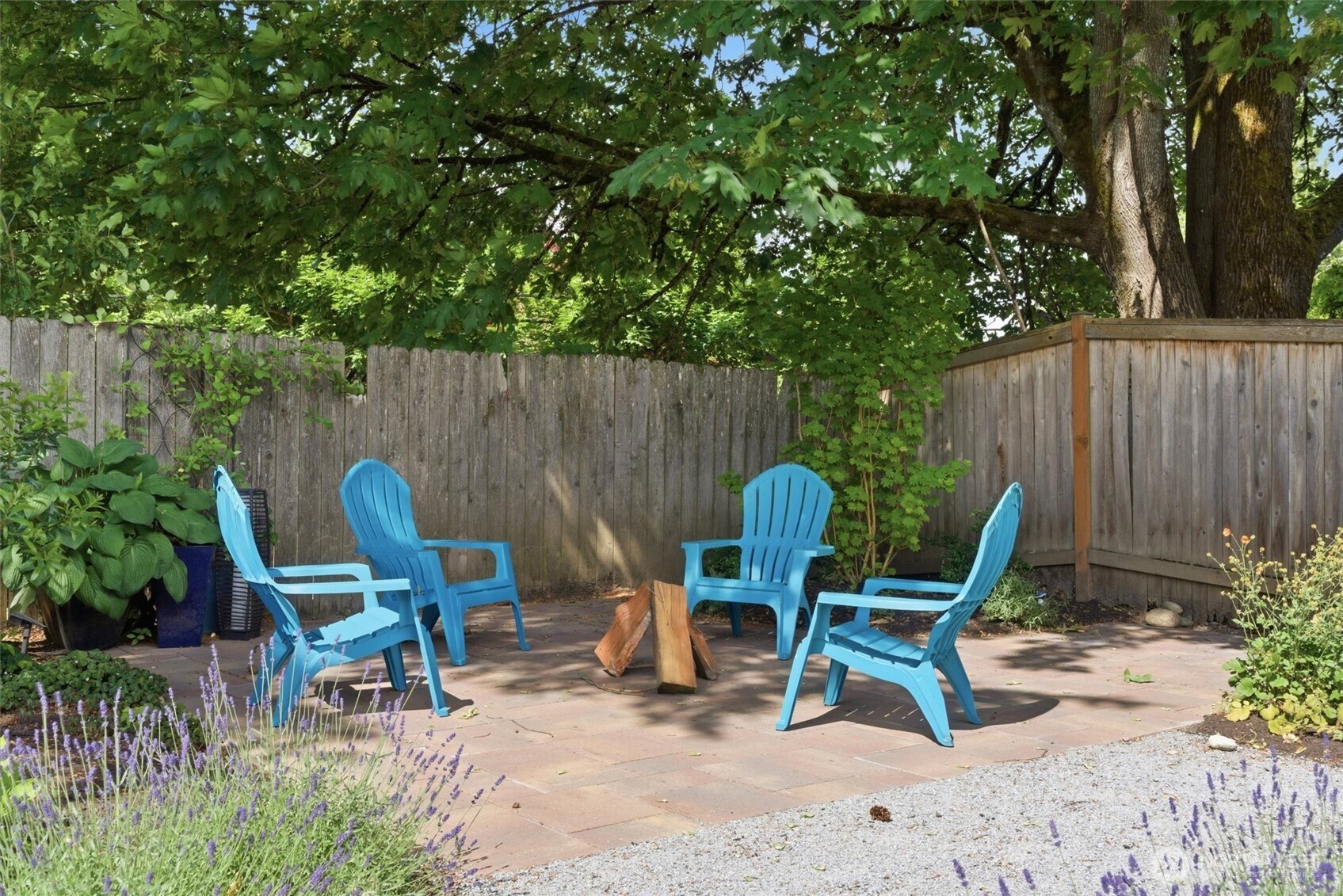 2101 233rd Street Southeast Bothell, WA 98021 - Photo 31 of 40 a view of chair and table in backyard