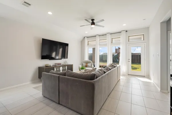 a living room with furniture and a flat screen tv