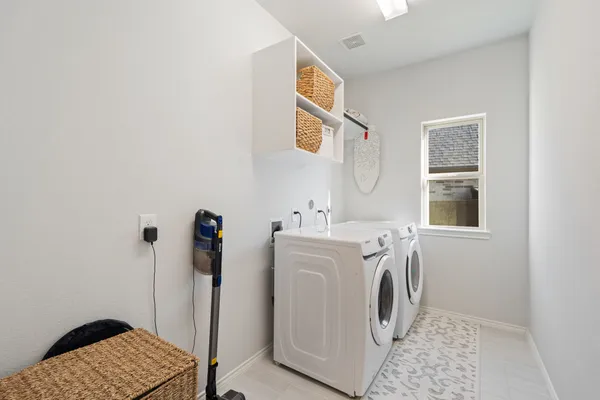 a utility room with dryer and washer