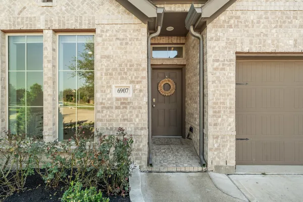 a view of a door of a house with outdoor space