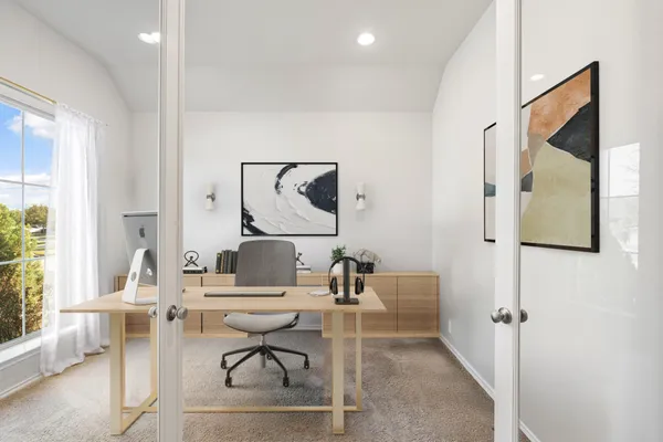 a work room with furniture and a window