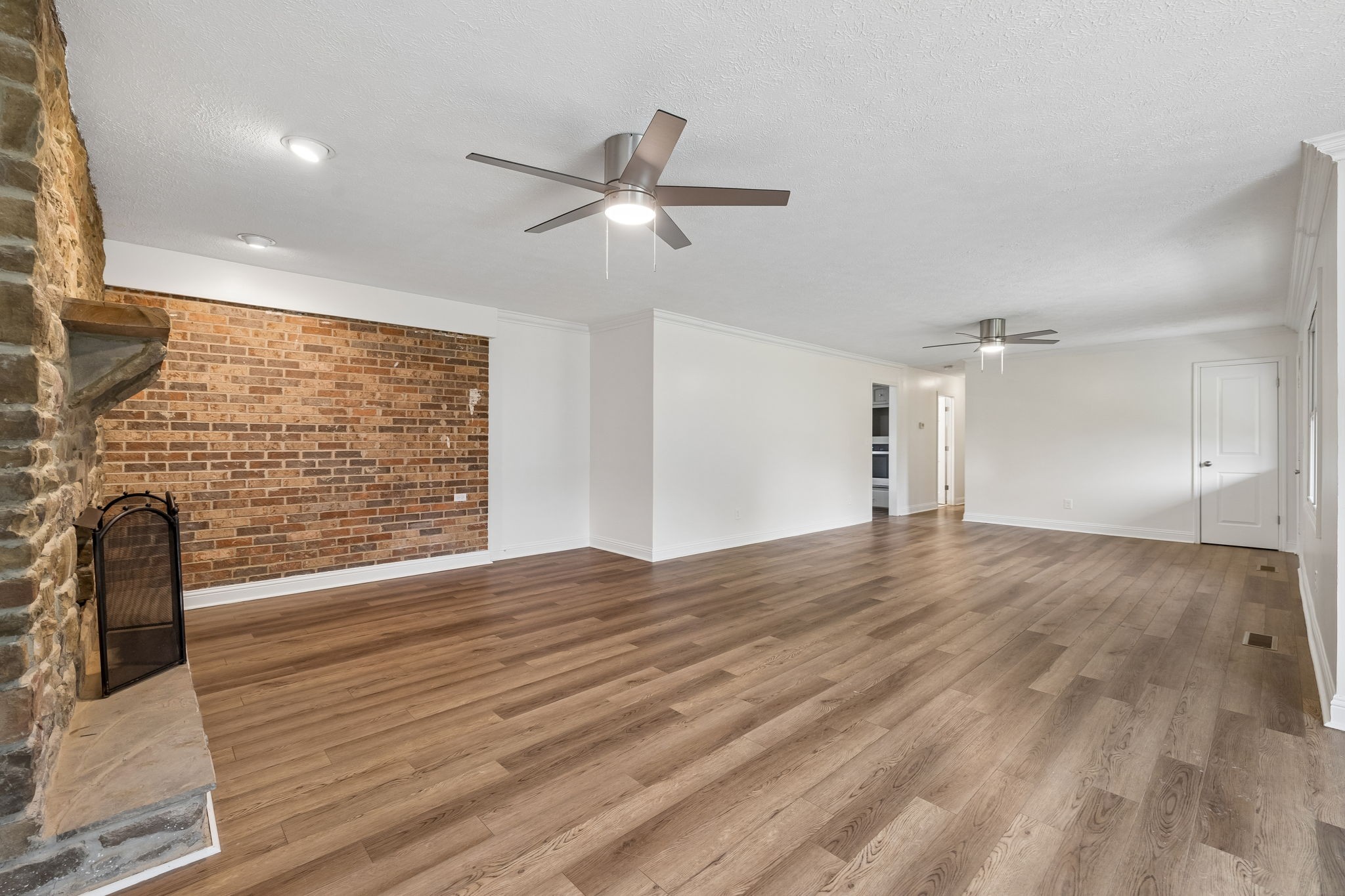 1397 East Blue Creek Road Waverly, TN 37185 - Photo 12 of 93 a view of empty room with wooden floor and fan