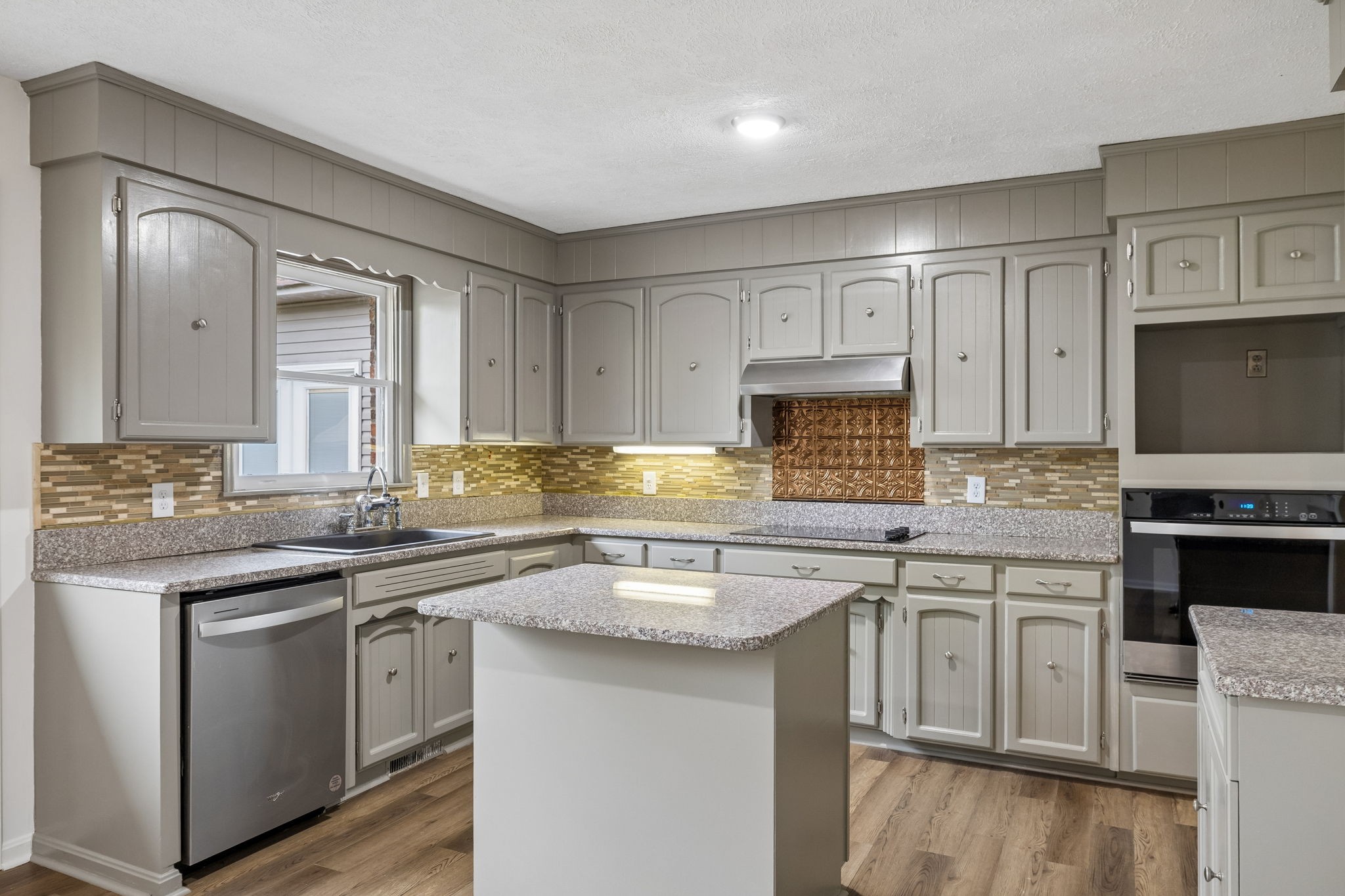 1397 East Blue Creek Road Waverly, TN 37185 - Photo 20 of 93 a kitchen with stainless steel appliances granite countertop a sink stove and cabinets
